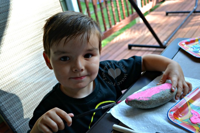 preschool-boy-painting-rocks